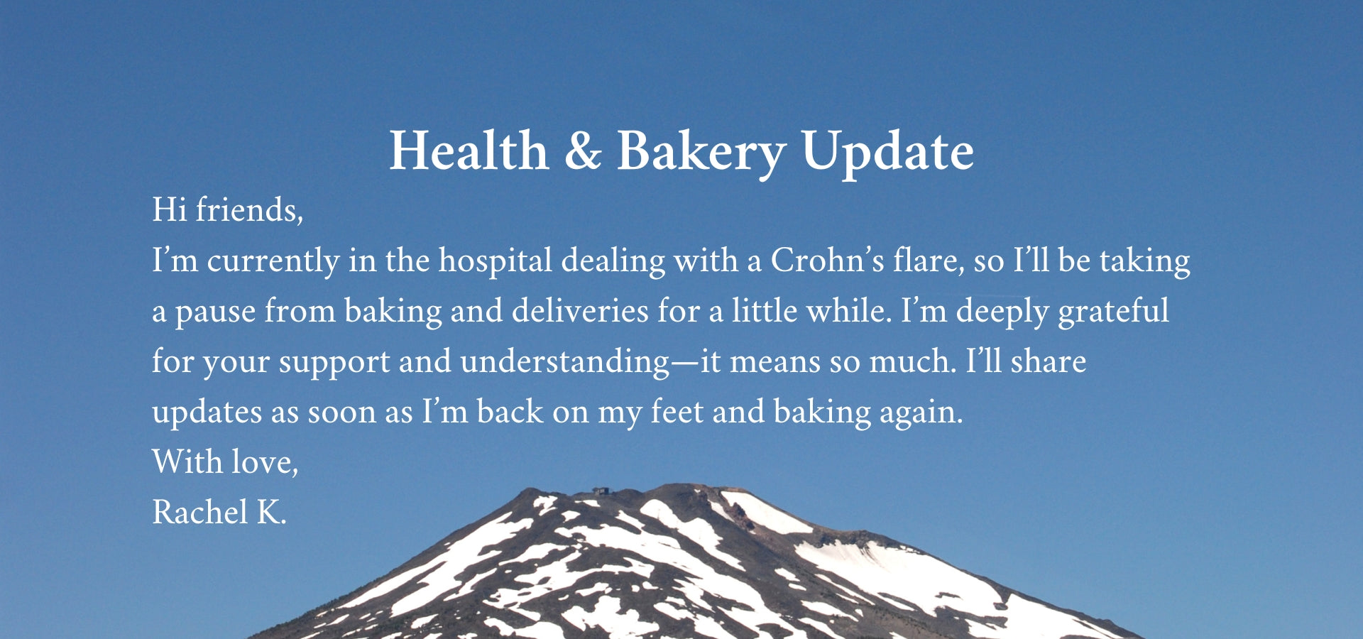 Message about health and bakery update with a mountain silhouette on a blue background